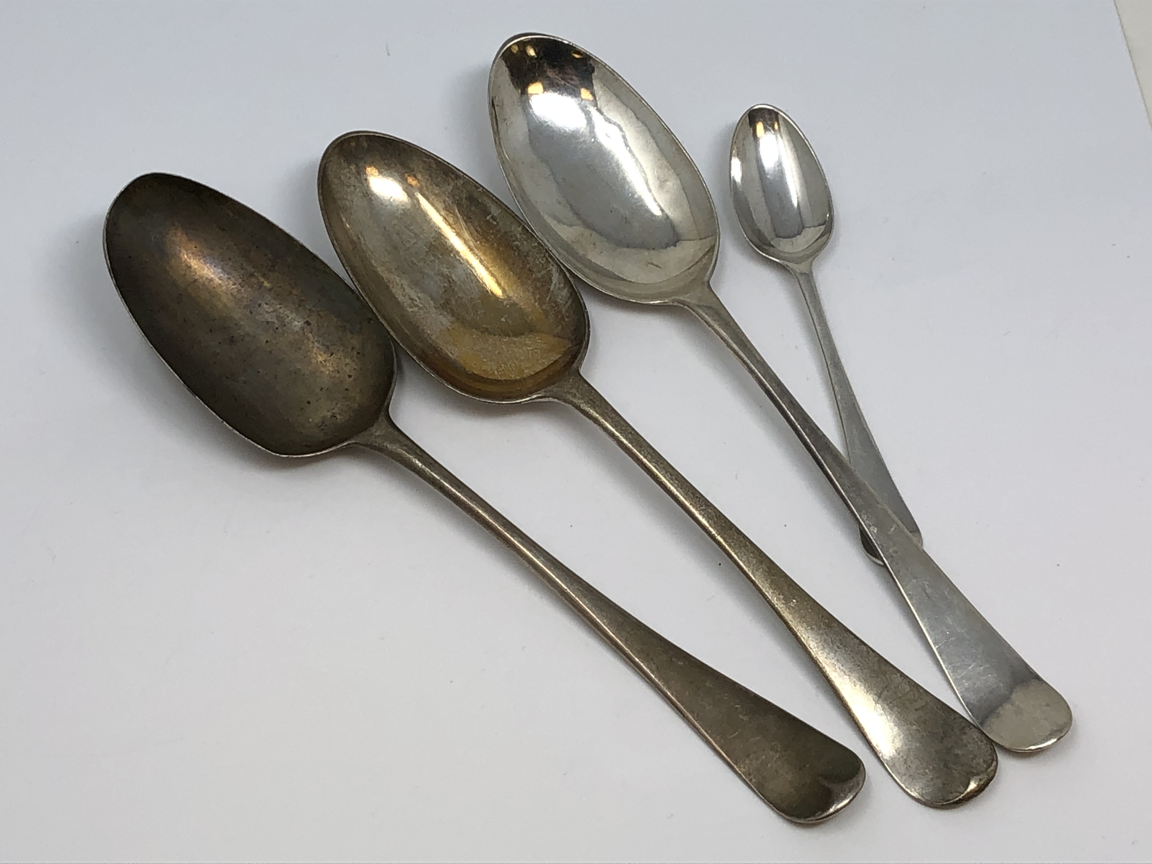 Four heavy Georgian silver spoons