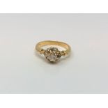 An 18ct gold diamond cluster ring, centre stone approx. 0.