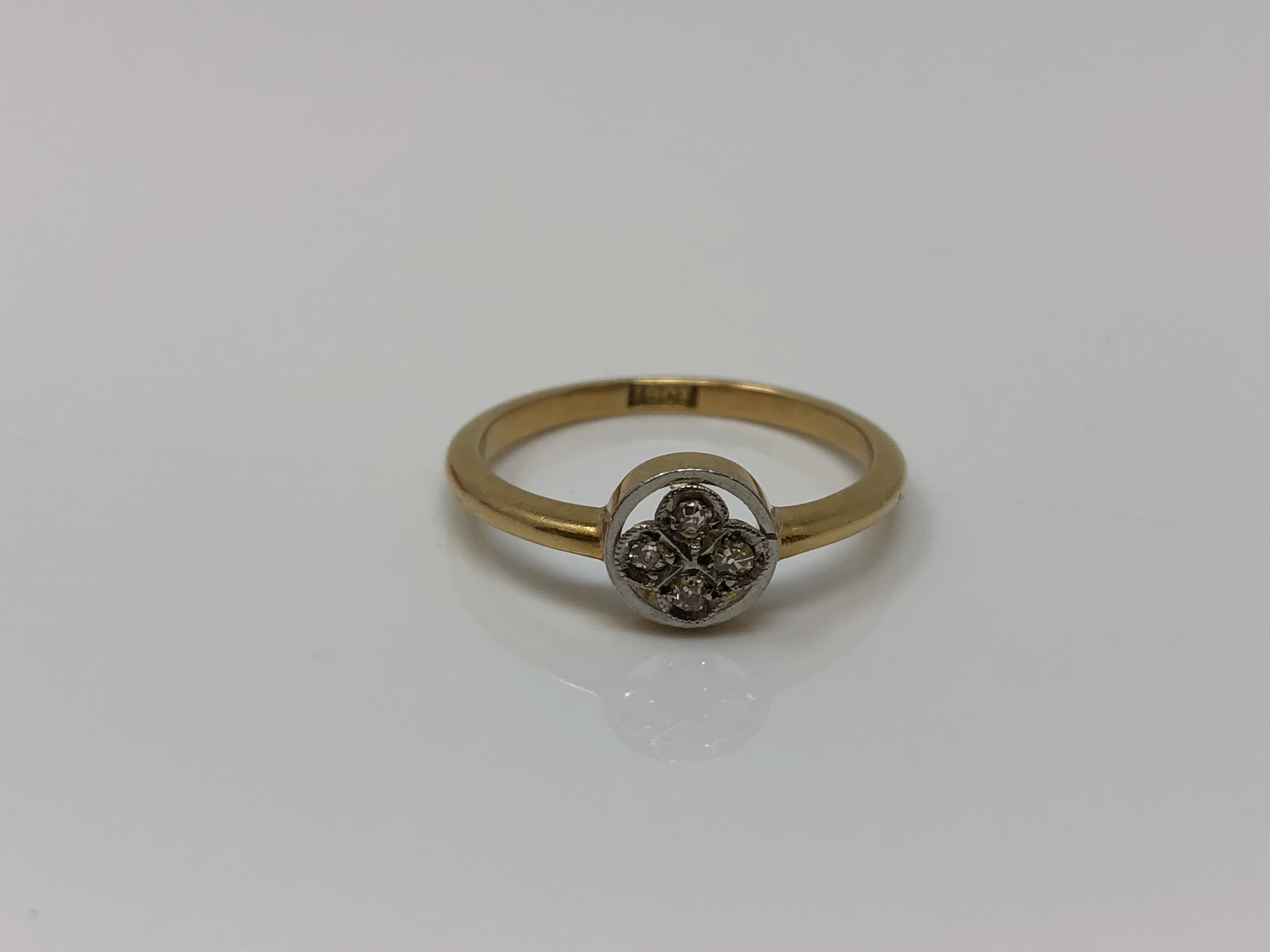 An antique 18ct gold gold four stone diamond ring, size N CONDITION REPORT: 2.