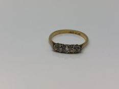 An 18ct gold five stone diamond ring, size M CONDITION REPORT: 1.