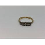 An 18ct gold five stone diamond ring, size M CONDITION REPORT: 1.