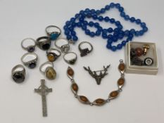 A collection of mostly silver jewellery to include dress rings set with amber etc,