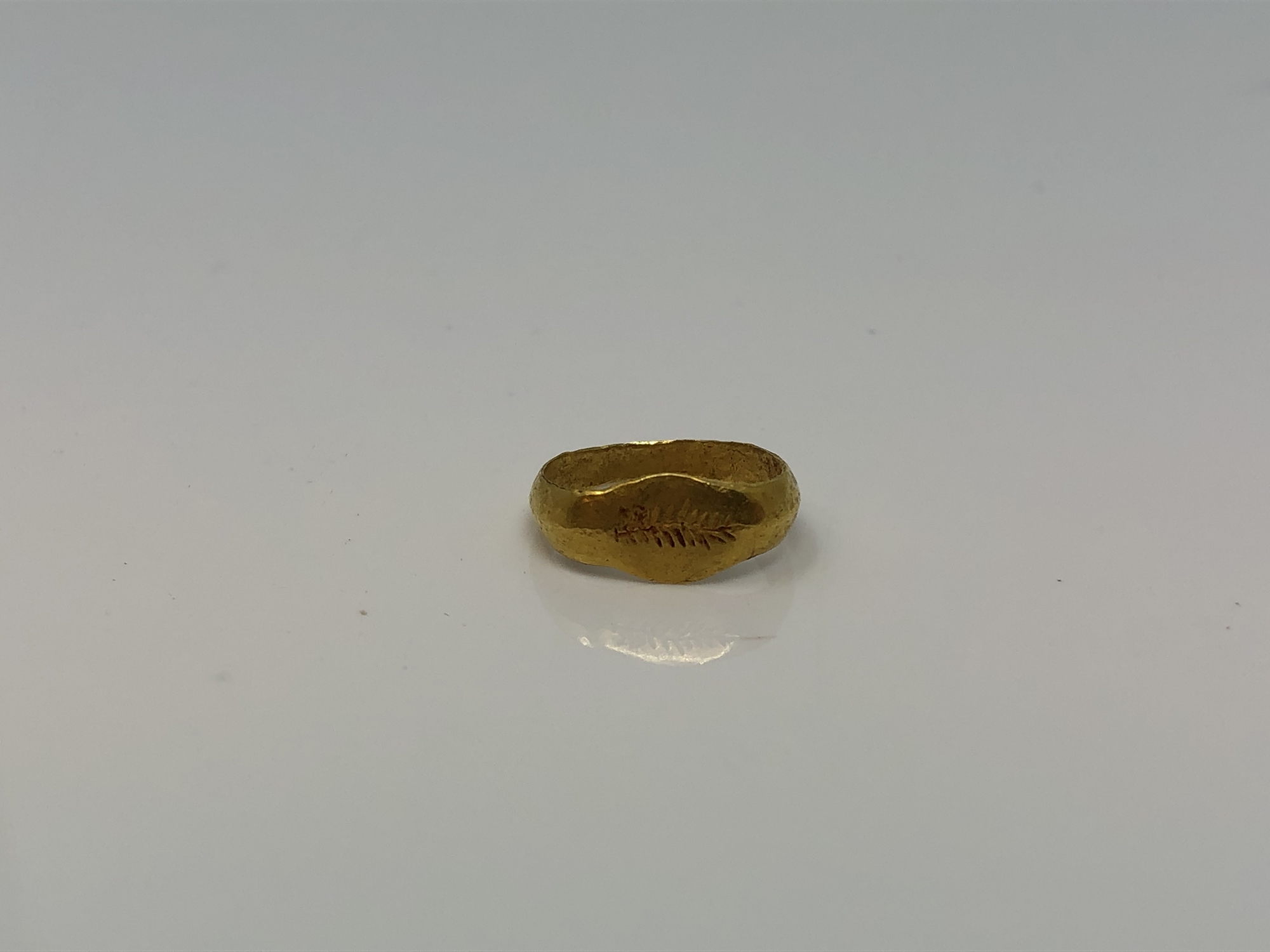 A Roman gold child's ring CONDITION REPORT: The ring lot 245 weighs approximately 1g,