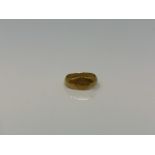 A Roman gold child's ring CONDITION REPORT: The ring lot 245 weighs approximately 1g,