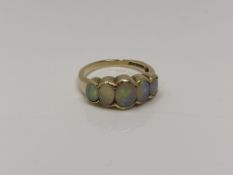 A 9ct gold five stone opal ring, size N CONDITION REPORT: 3.