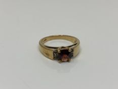 A 9ct gold garnet set ring, size N CONDITION REPORT: 3.