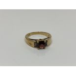 A 9ct gold garnet set ring, size N CONDITION REPORT: 3.