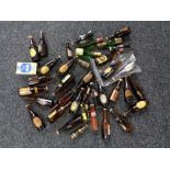 A quantity of miniature and other bar top bottles