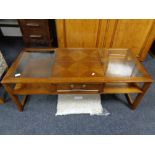 A G-plan glass topped coffee table fitted with a drawer