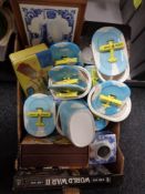 A box of Utterly Butterly dishes, blue and white caddy,