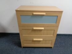 An Ikea light oak three drawer chest