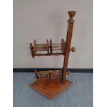 A mid century pine double wool winder stand