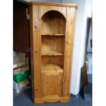 A pine corner cabinet