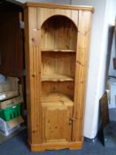 A pine corner cabinet