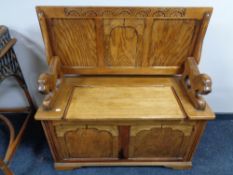 An Edwardian oak monk's bench