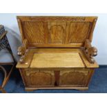 An Edwardian oak monk's bench