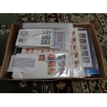 A box of first day covers and stamps,