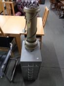 A vintage floor standing electric heater together with a metal six drawer chest