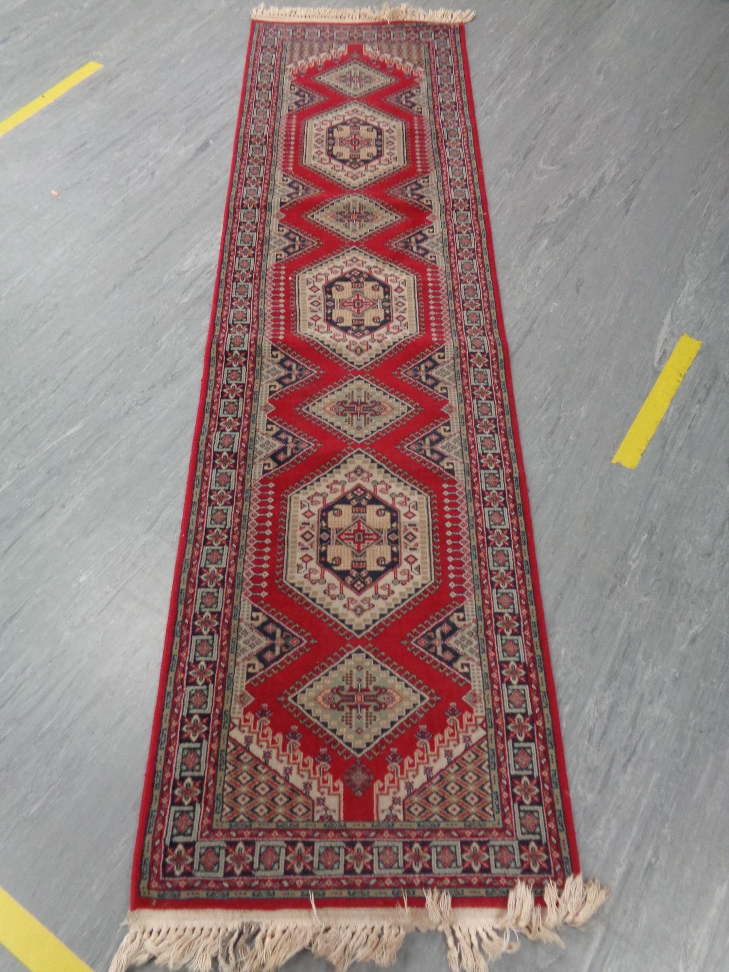 A traditional style Afghan carpet runner,