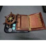 An antique writing box together with a brass mounted ship's wheel,