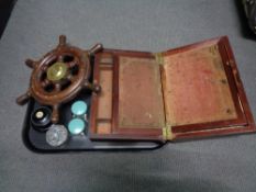 An antique writing box together with a brass mounted ship's wheel,