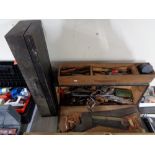 An antique tool box containing tools, woodworking planes including Stanley No.