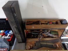 An antique tool box containing tools, woodworking planes including Stanley No.