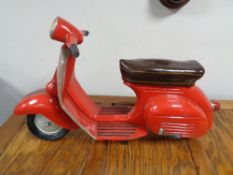 A large model of a Vespa scooter CONDITION REPORT: 58cm long by 22cm wide by 35cm