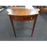 A reproduction mahogany shaped side table fitted with a drawer