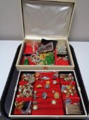 A mid century jewellery box with lift out tray containing rings, brooches, beaded necklaces,