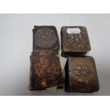 A bag of three antique silver fronted miniature prayer books and one other