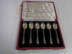 A set of six silver teaspoons representing the six hallmarks of London, Chester, Edinburgh, Glasgow,