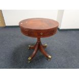 A reproduction Regency style drum table