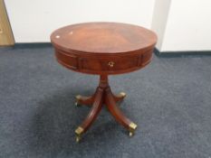 A reproduction Regency style drum table