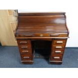 A nineteenth century mahogany roll topped desk