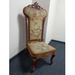 A Victorian walnut framed tapestry upholstered prayer chair