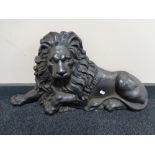 A Victorian cast iron door stop modelled as a recumbent lion CONDITION REPORT: Some
