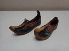 A pair of nineteenth century leather stitched child's slippers