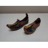 A pair of nineteenth century leather stitched child's slippers