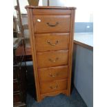 A reproduction five drawer audio chest