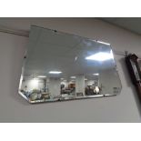 An Edwardian frameless mirror