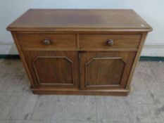 A Victorian mahogany side cabinet fitted with two drawers