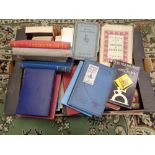 A box of various books,