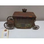 An antique Jacobs biscuit tin in the form of a state carriage