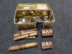 A quantity of vintage wooden pegs, oxo tins,