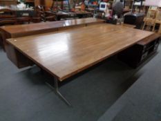 A mid century veneered boardroom / dining room table, on metal legs,