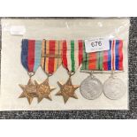 A set of five WW II medals on ribbons