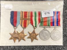 A set of five WW II medals on ribbons