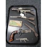 A collection of miniature rifles and pistols,
