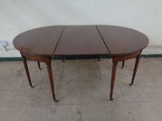 An early nineteenth century mahogany D-end dining table with leaf CONDITION REPORT: